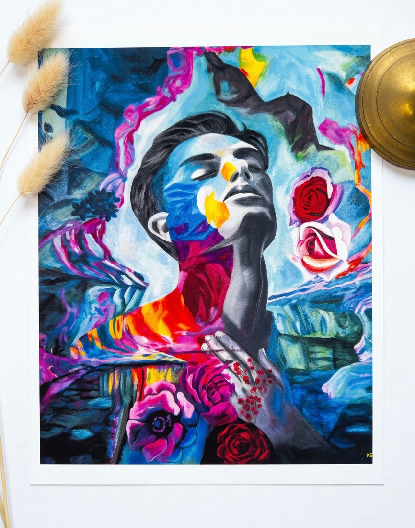 An image of a print of a man surrounded by abstract swatches of paint, turquoise and pink.