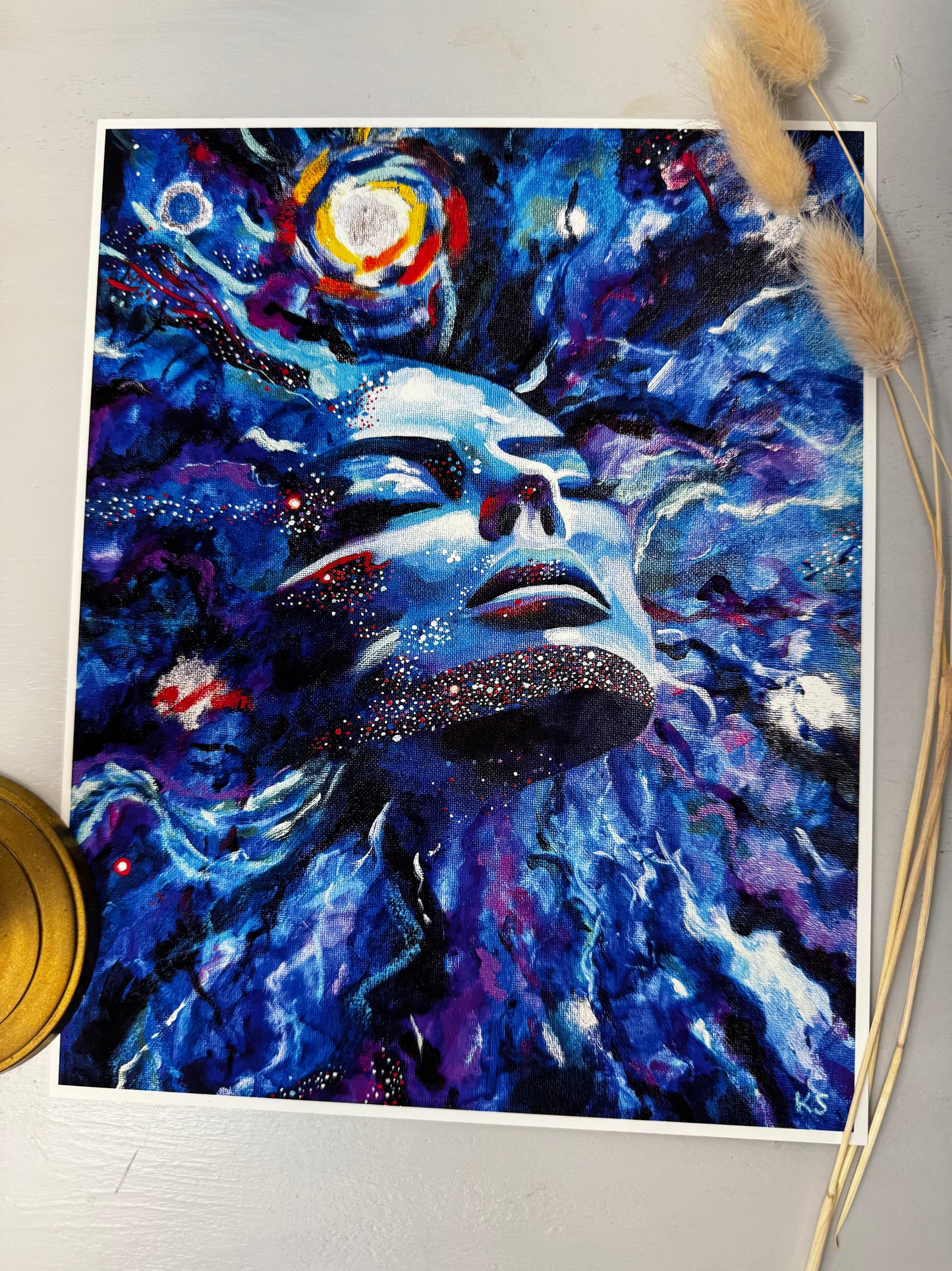 Abstract art print with a face emerging from a galaxy or cosmos with starry swirling abstract elements.
