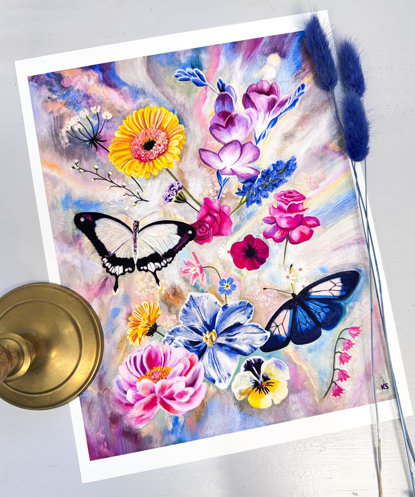 A print featuring flowers and two butterflies against a opalescent background