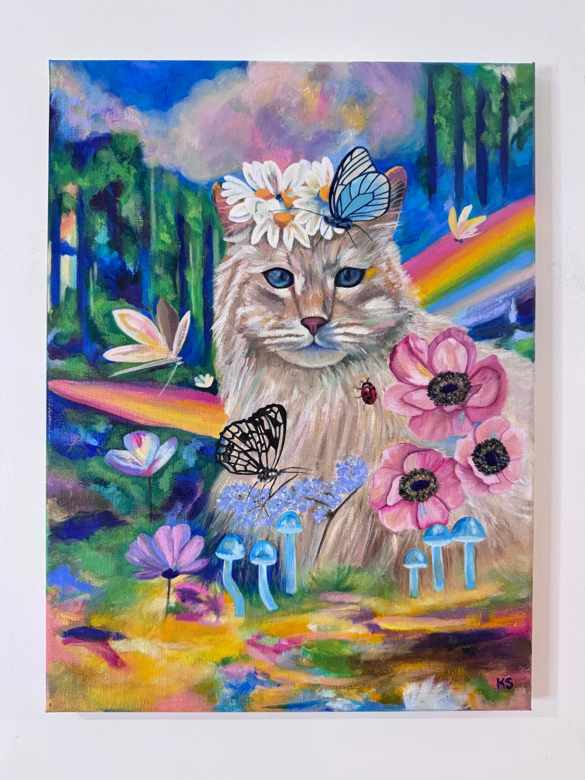 Painting of a cat with butterflies, flowers mushrooms, ladybug and fairies