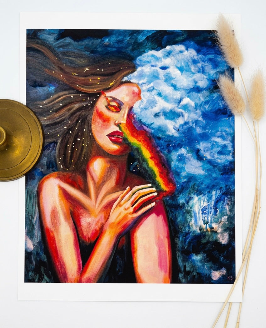 A picture of a print featuring a woman with a rainbow obscuring her vision, and blue dripping sky