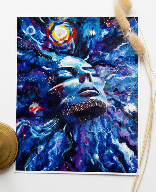A print featuring a blue face in a galaxy