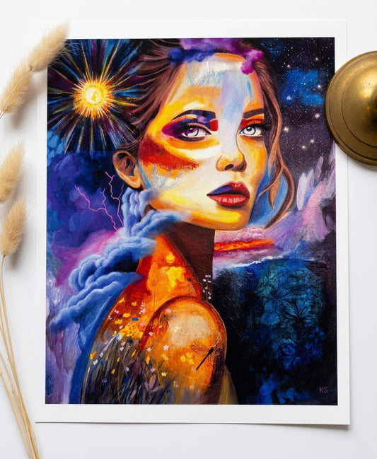 A print of a woman in a galaxy with a field of flower and a sunburst. 