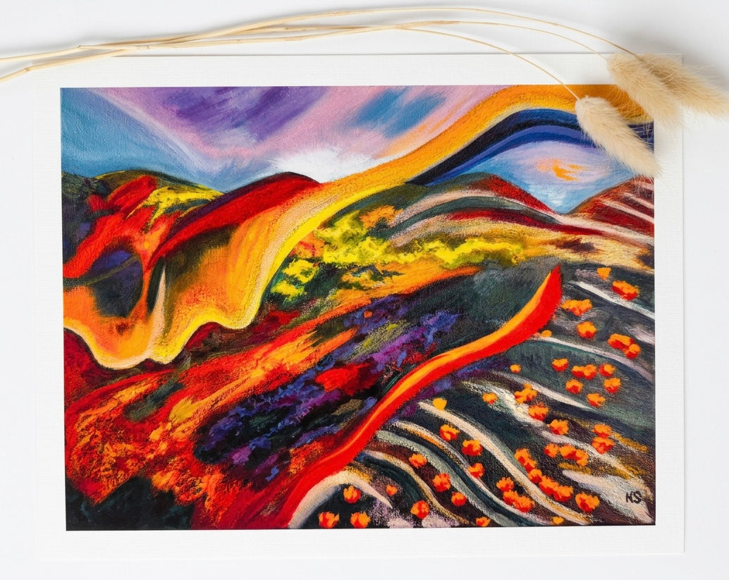 A print of an abstract landscape, green and orange.