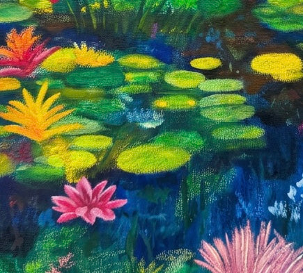 A close up of Lily pads in a pond. Oranges and greens and yellows and blues