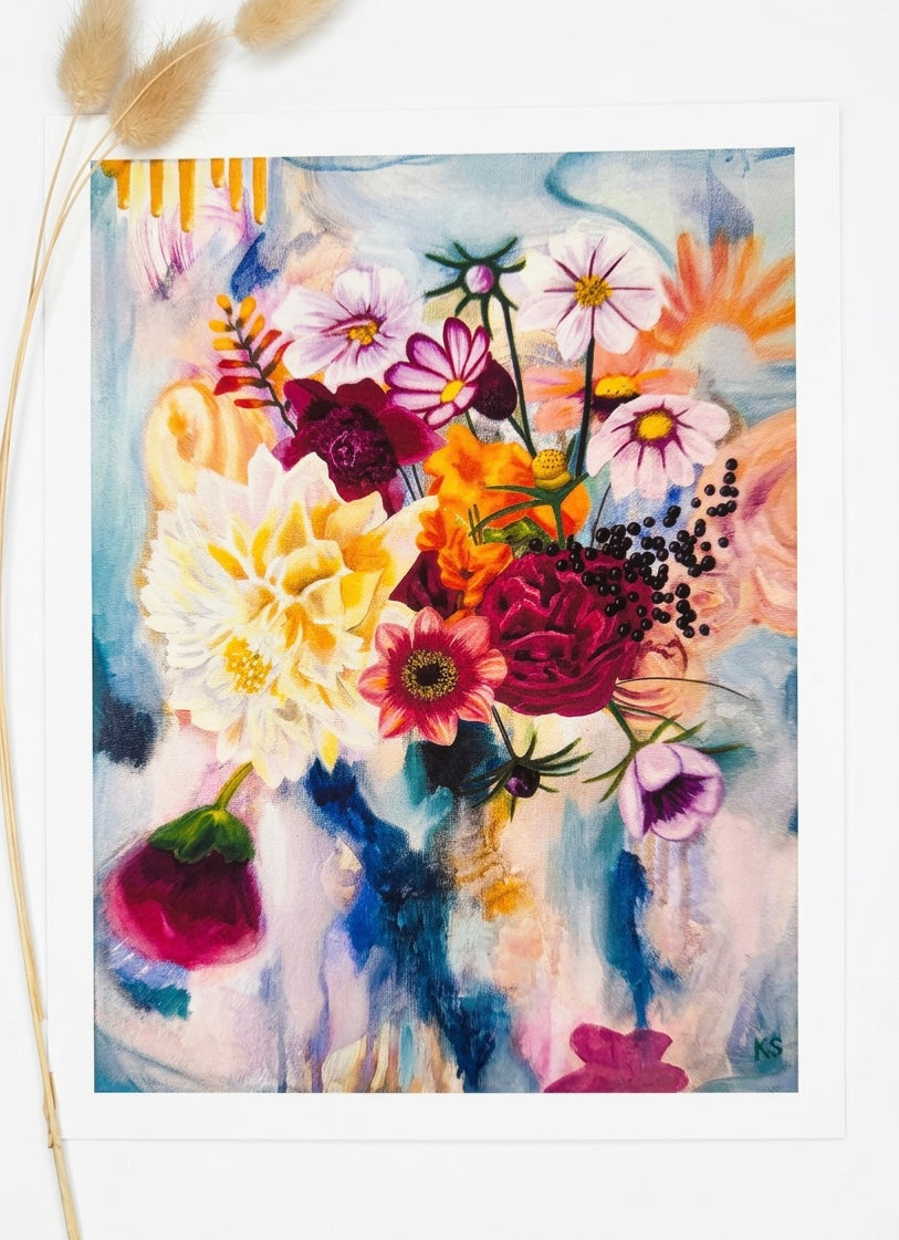 A print of a floral arrangement with gold drips.