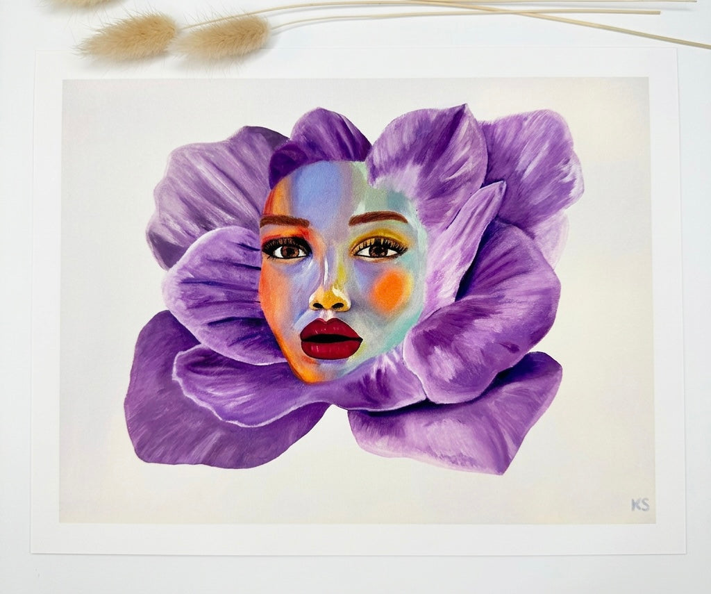 A print of a portrait of a woman who’s face is merged with a purple flower.