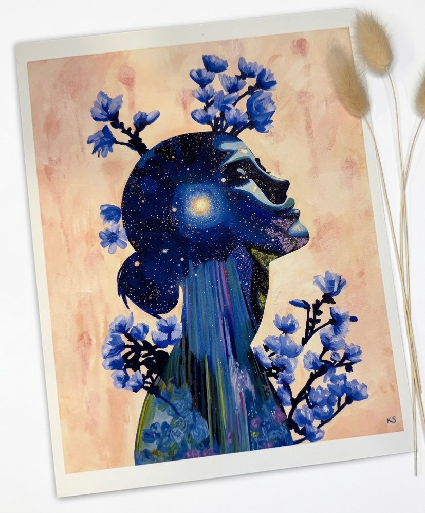 A print of a silhouette of a woman filled with a galaxy against an orange abstract background