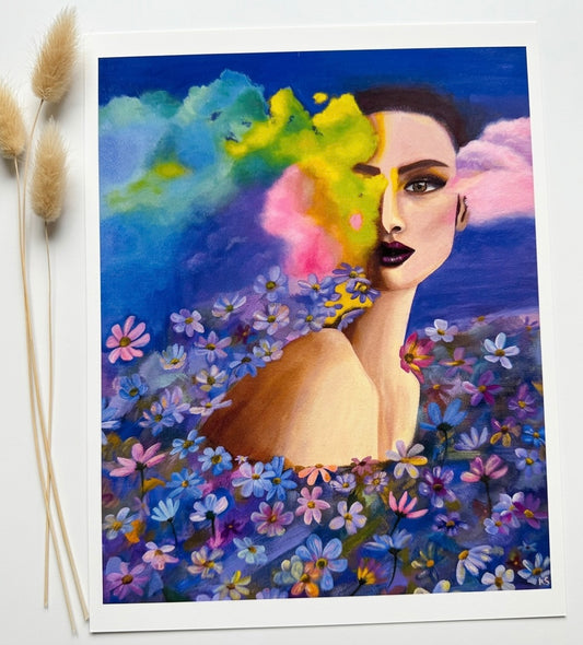 A print of a woman in a field of flowers with vibrant coloured clouds