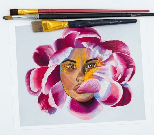 A print of a woman’s face merged with a purple and pink flower against a pale blue background