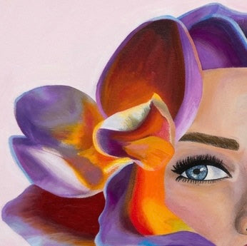 A close up of a woman’s face merged with a multi coloured flower against a soft pink background