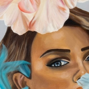 A close up of a portrait of a woman surrounded by large flowers and transparent blue fabric