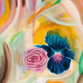 A close up of painted flower and rainbow swatches of paint. 