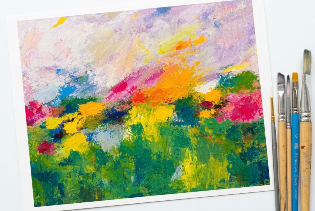 A print of an abstract landscape with flowers and a pastel sky.