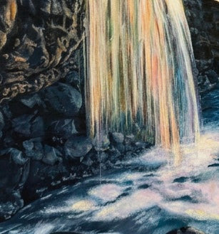A close up of a painted waterfall with rocks
