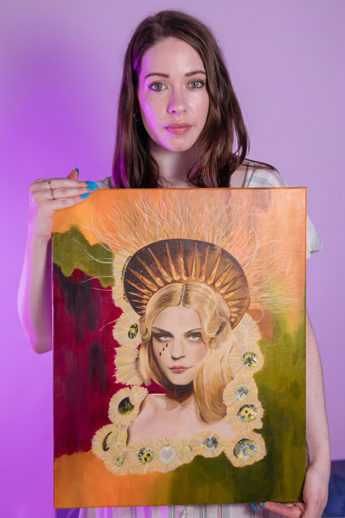 A picture of the artist Kelly Schnobb holding up a painting titled “Jessica Stam Runway”