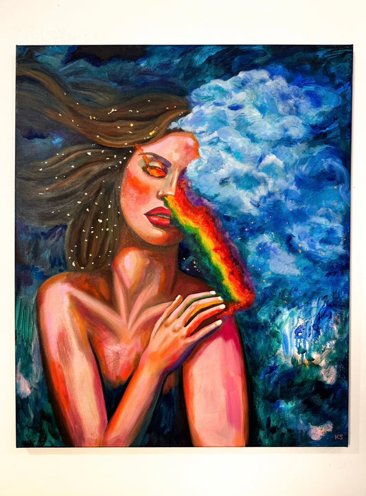 Artistic depiction of a woman with a rainbow across her face in a moody blue sky and gold flecks in her hair.