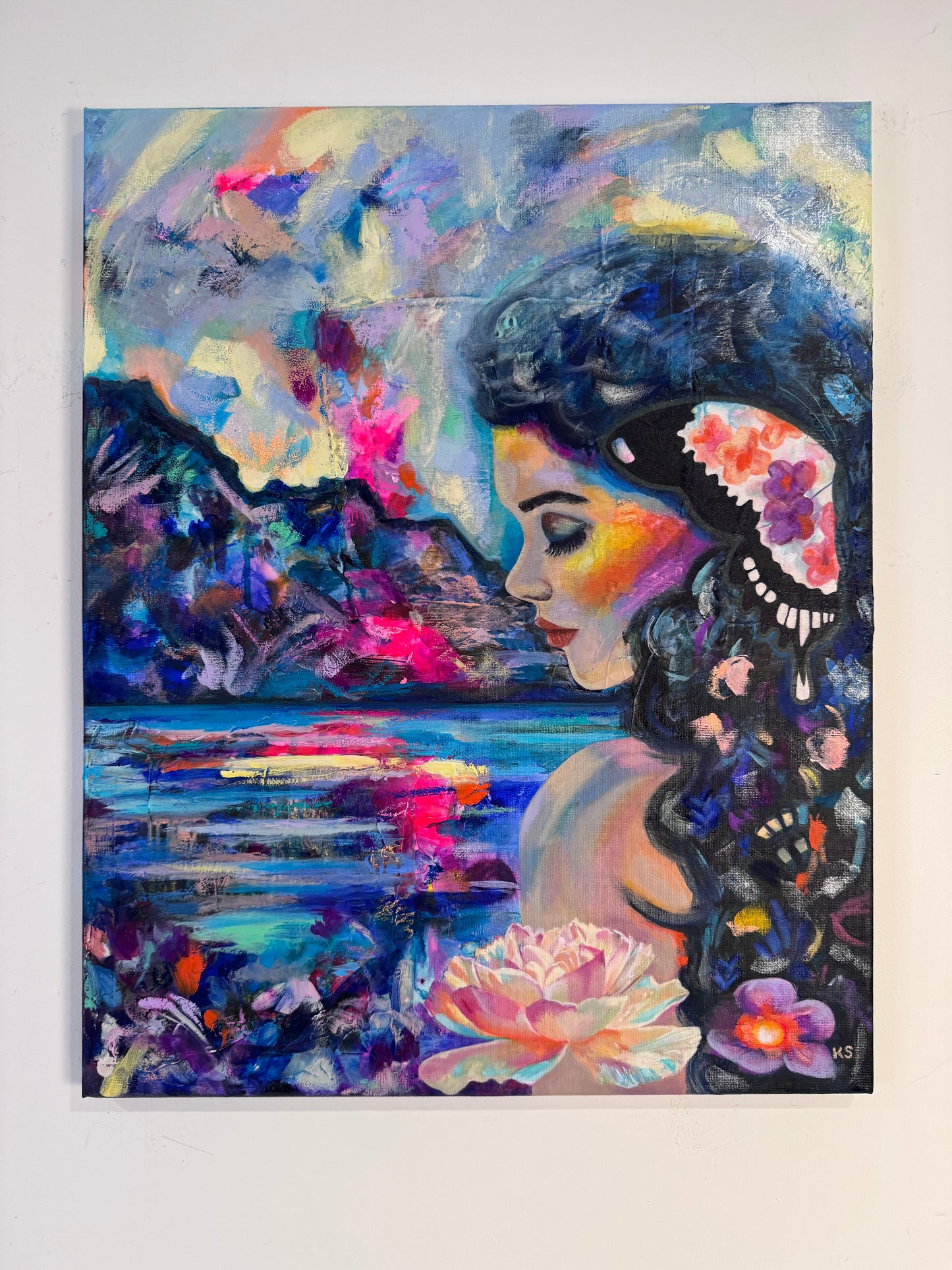 Colorful painting of a woman with flowers and a lake scene