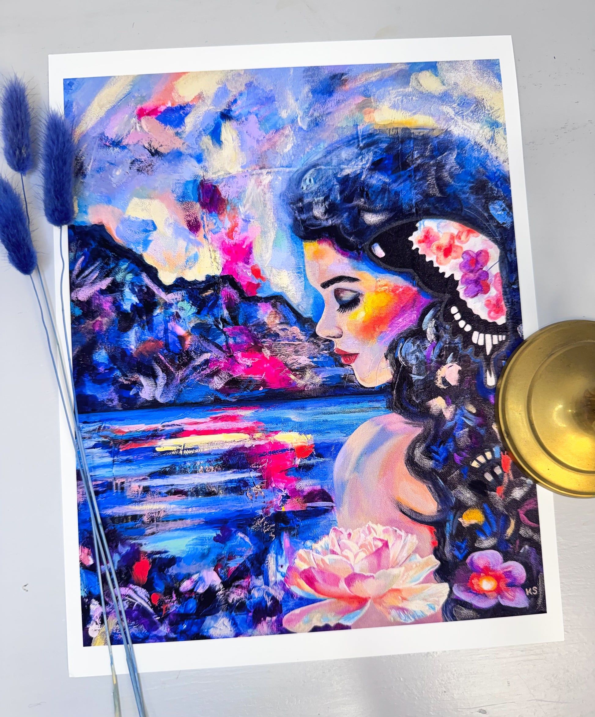 Colorful painting of a woman with flowers and abstract elements on a white background