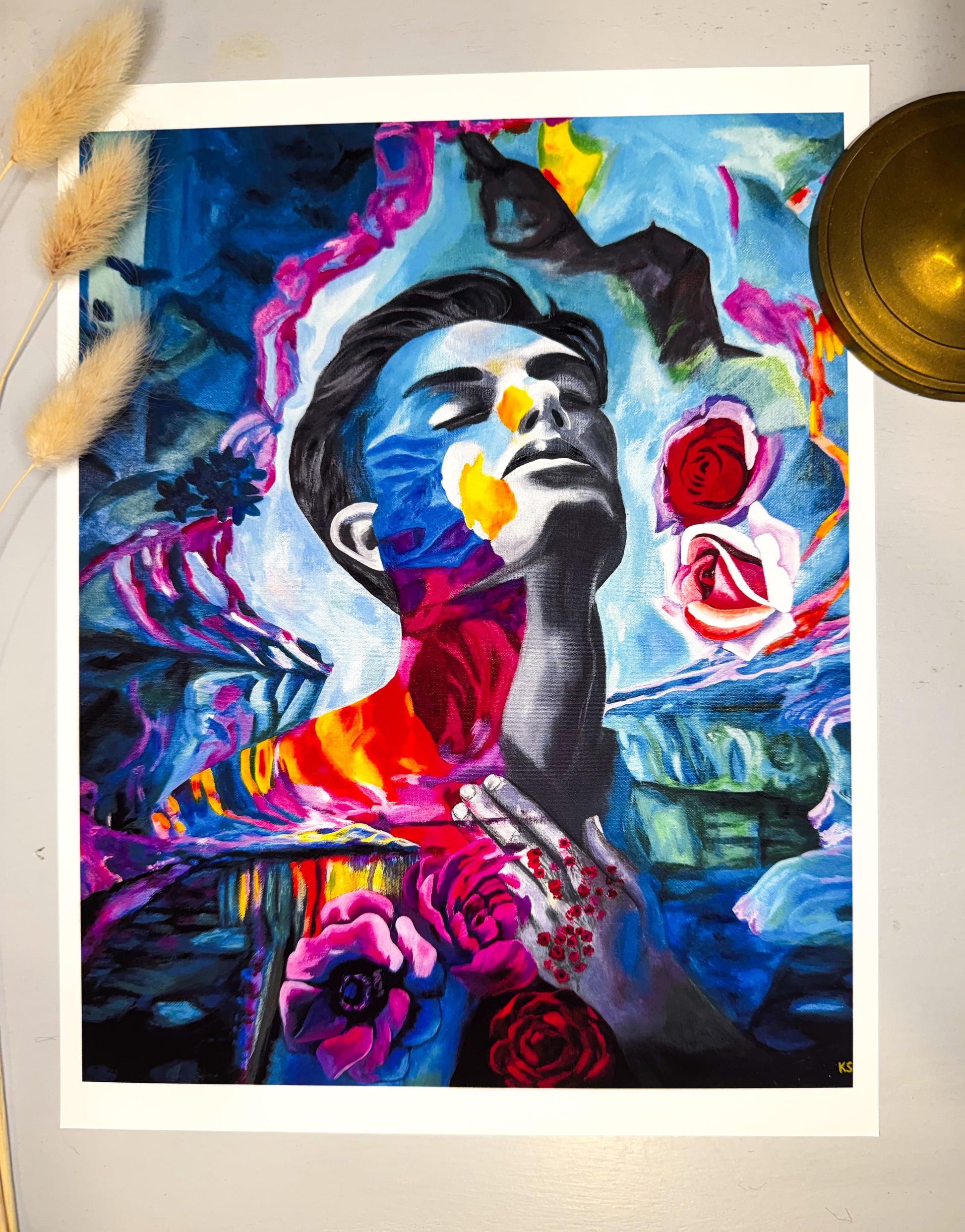 Colorful art print of a portrait of a man face with flowers on a white background