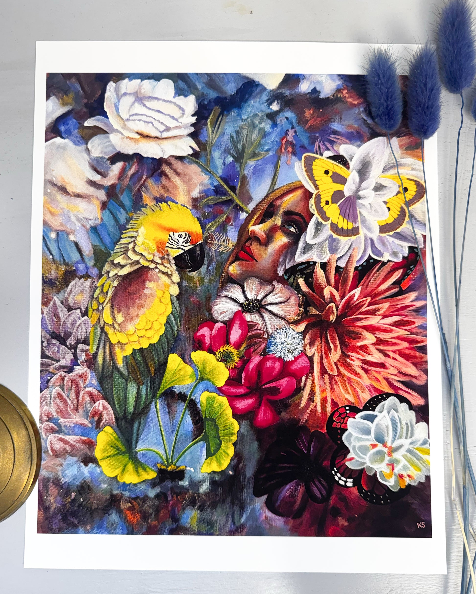 Colorful artwork with a parrot, flowers, and butterflies on a white background