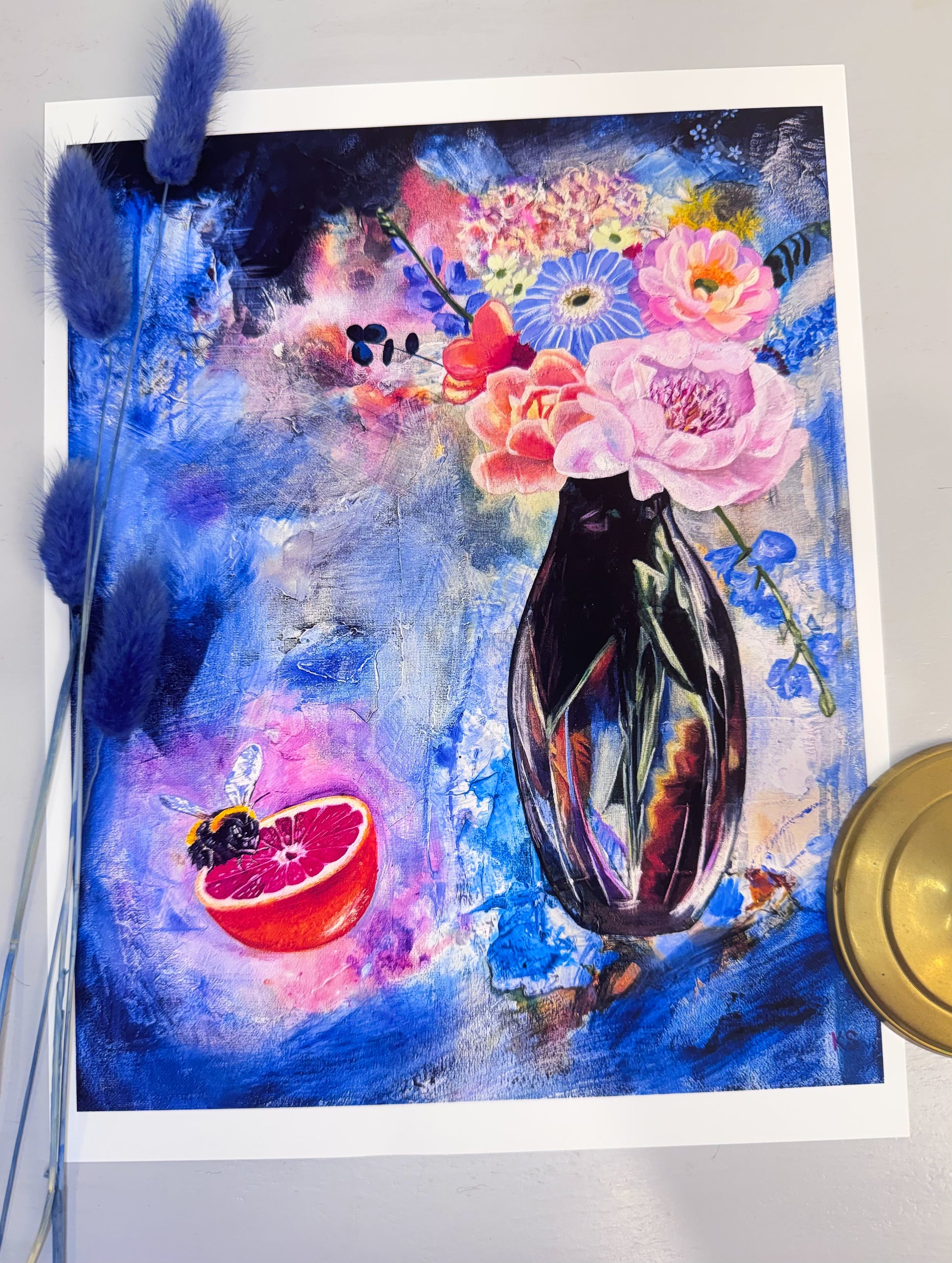 Colorful floral painting with a vase, flowers, and an grapefruit and a bee
