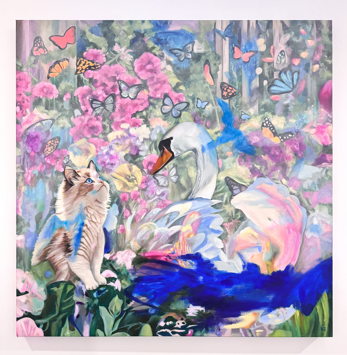A painting of a cat lovingly gazing at a swan surrounded by flowers and butterflies with abstract swatches of paint. 