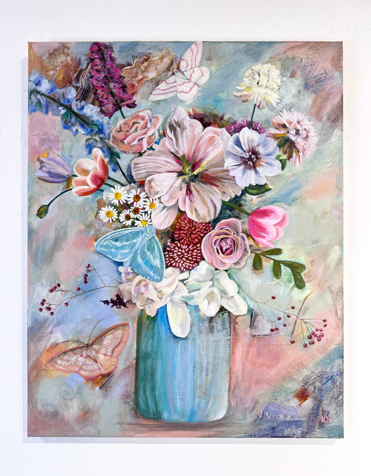 A colorful floral painting featuring a bouquet of pink, white, purple, and blue flowers in a blue vase, with moths and a soft pastel background.