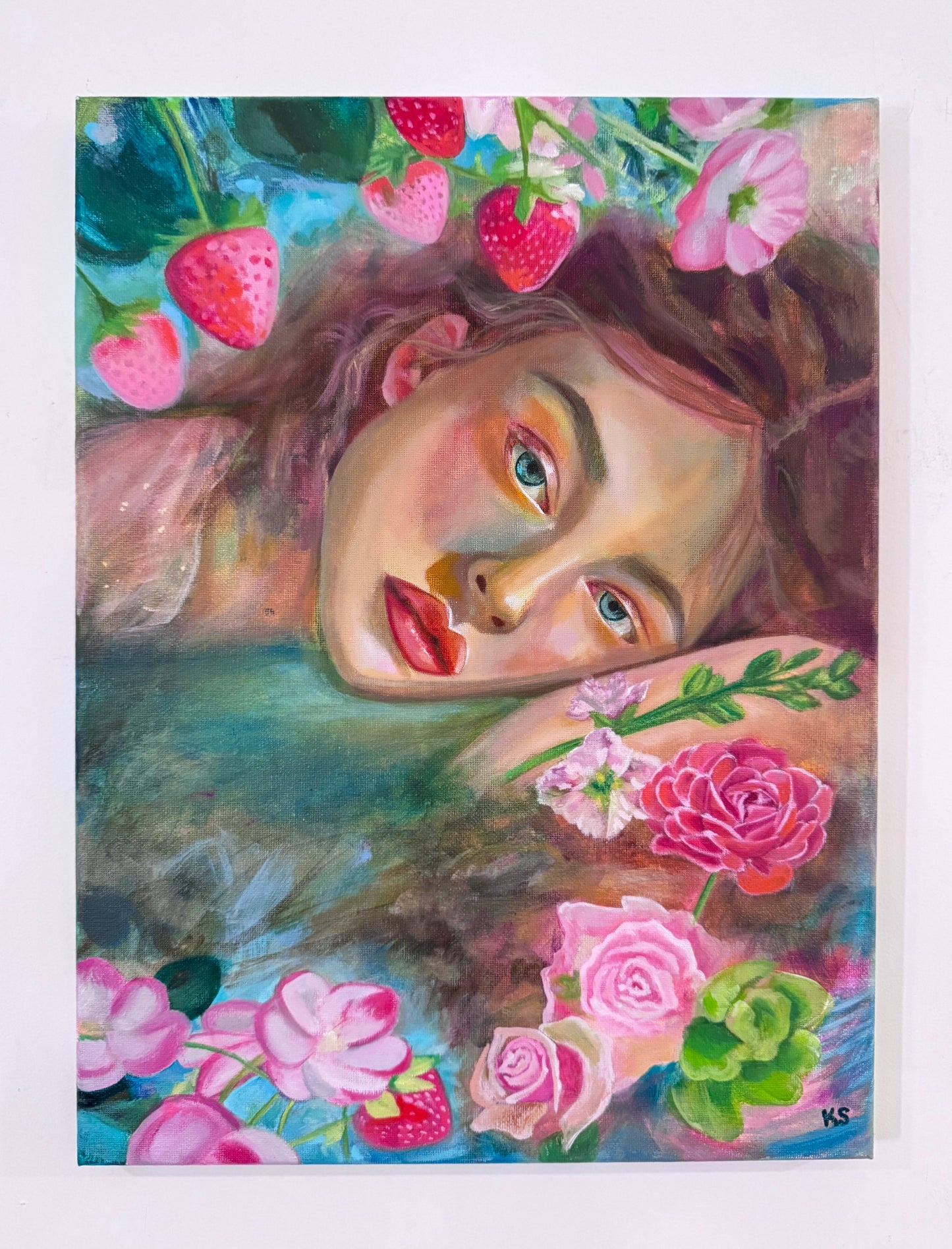 Artistic depiction of a woman's face surrounded by flowers and strawberries on a white background