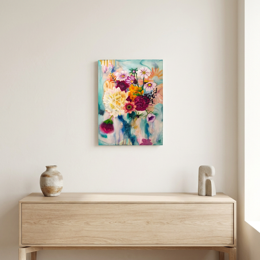 Fragrant Symphony 12 × 16-inch floral canvas shown at a small scale above a pale wood console in a neutral room, without text, frame, or border.