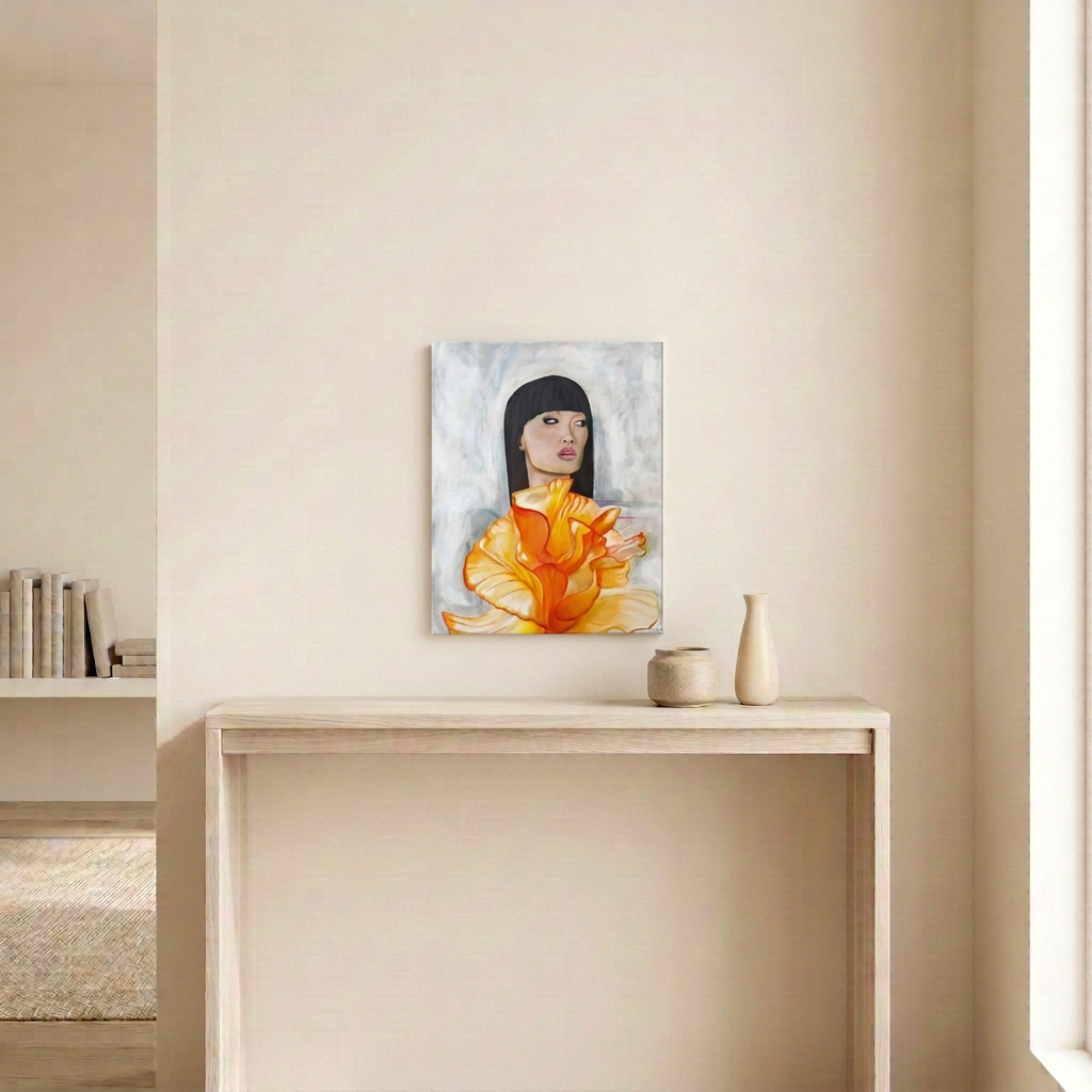 It’s Couture original painting of a woman with a black bob and orange floral dress, displayed unframed above a pale wood console in a neutral room.