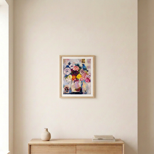 Hope In Bloom floral and blue bird print in a slim light wood frame above a pale wood console in a neutral room.