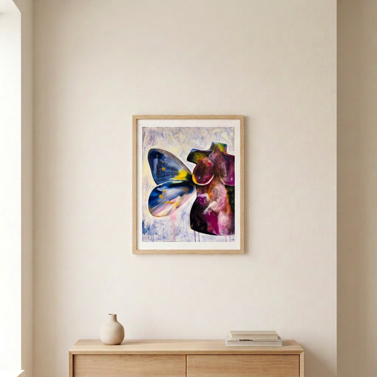 Torso Volume 5 Print in a light wood frame with a white border above a pale wood console in a neutral room.