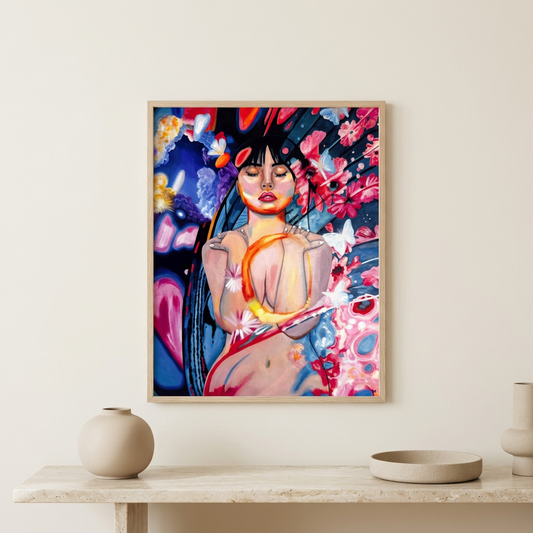 Softly Blooming original artwork in a vertical light-wood frame in a neutral room